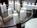 Chemical Bottles with Rotary Infeed-Outfeed Tables